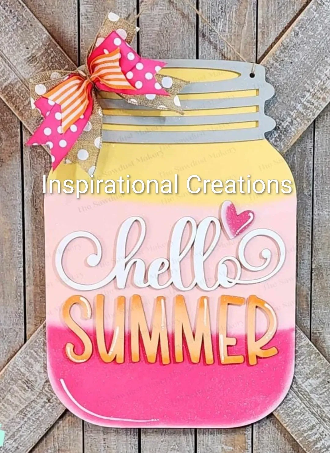 The Hello Summer wooden jar has been painted yellow and pink, with a bow affixed to the corner.